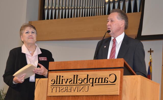 Dr. Frank Cheatham, left, senior vice president for academic affairs, complimented Dr. Brenda Priddy, dean of the School of Education, during the Excellence in Teaching Ceremony. (Campbellsville University Photo by Linda Waggener)