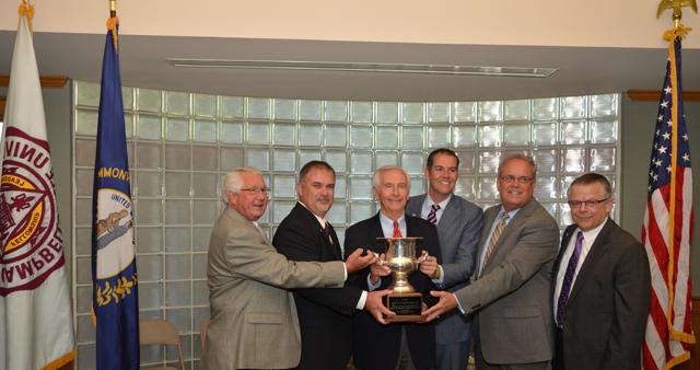 The Dignitaries at the event with Ky. Gov. Steve Beshear and holding the Governor's Cup for economic development